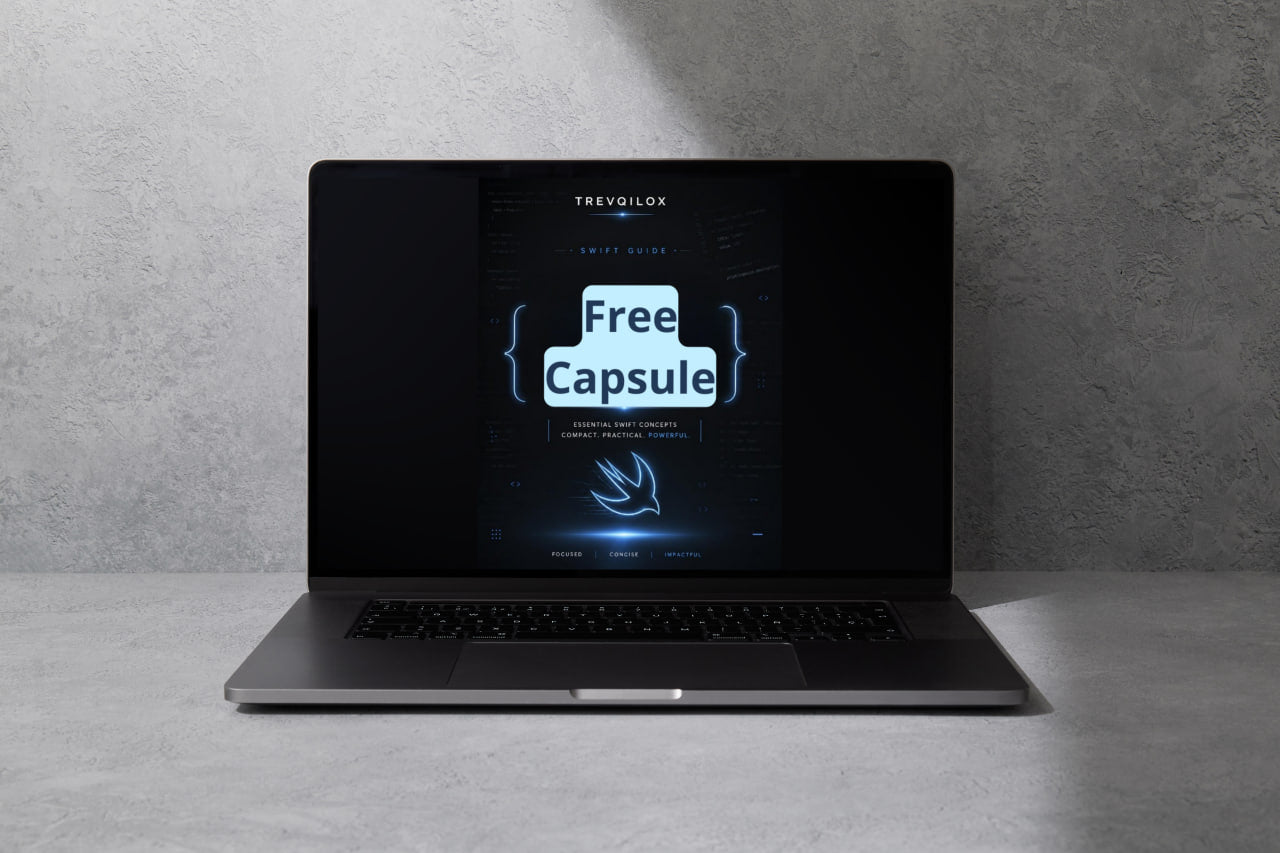 A dark gray laptop sits open on a light gray surface against a textured gray wall, with its screen displaying a digital graphic that reads 'Free Capsule' and the brand name 'TREVOLOX'.